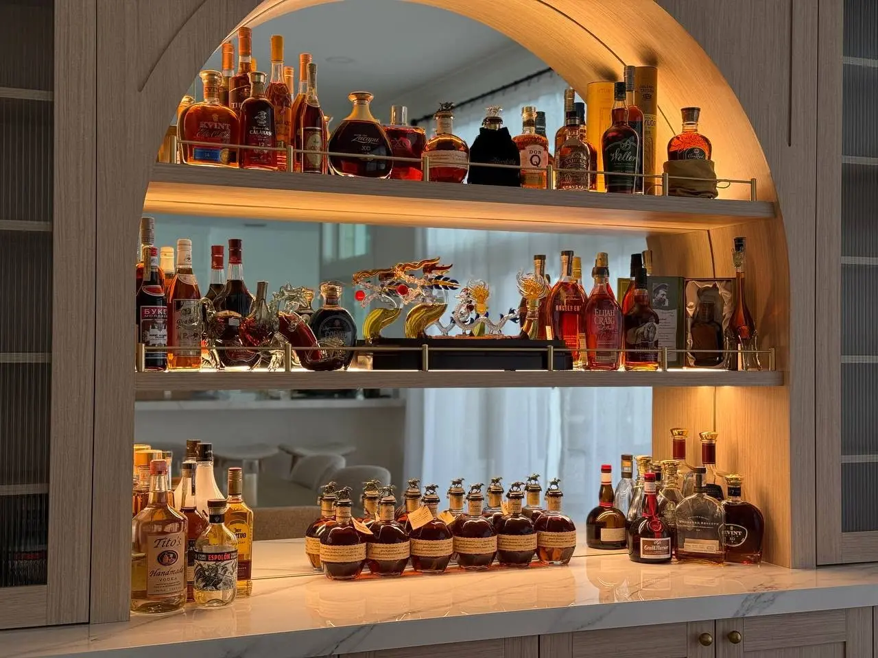 Illuminated custom home bar detail completed by LeVika Furniture