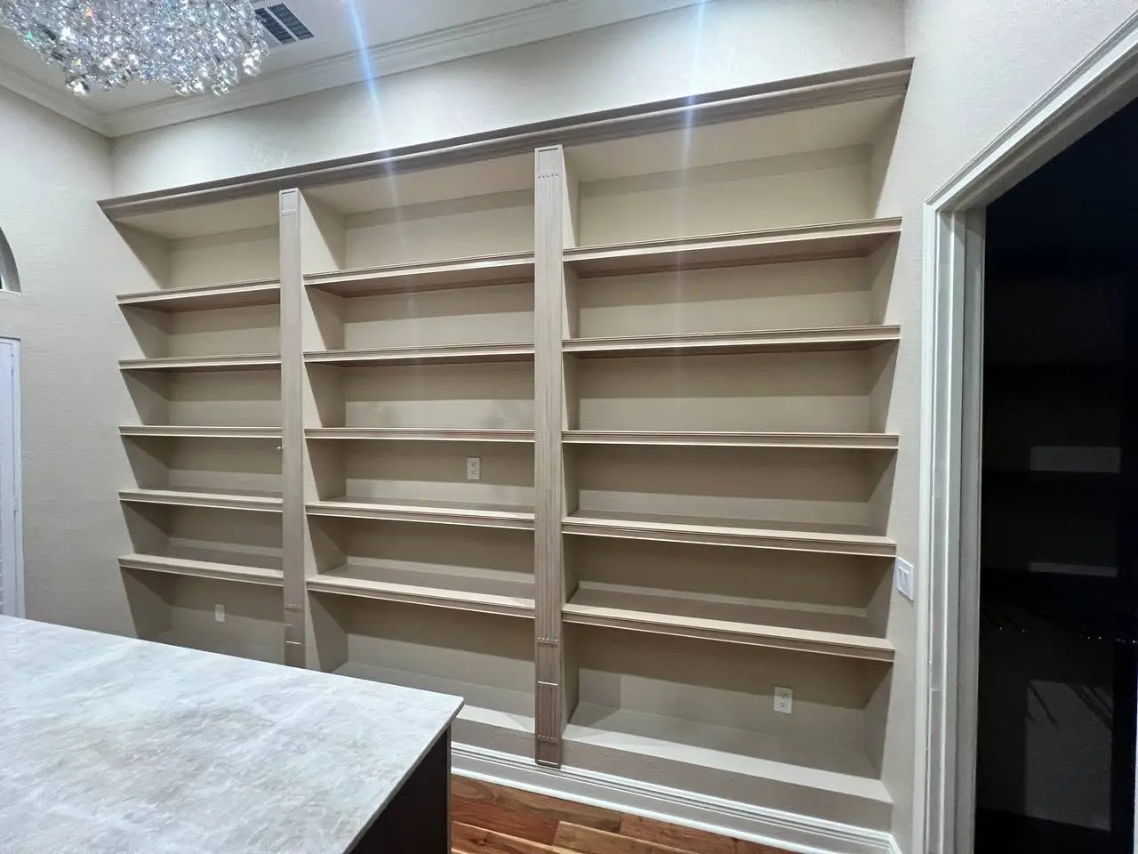 Open shelving and hanging zones in the completed walk-in closet