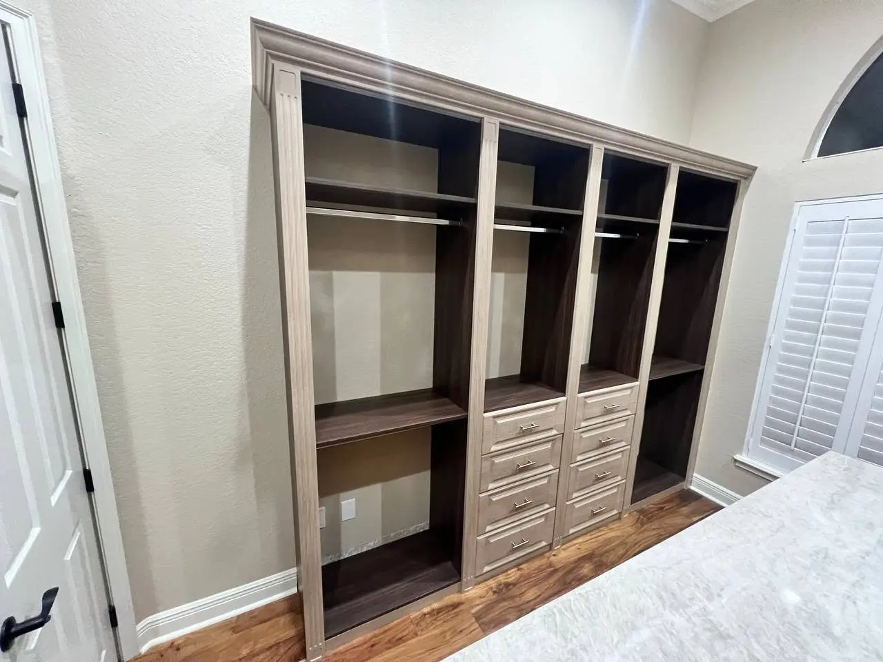 Full storage wall in the walk-in closet
